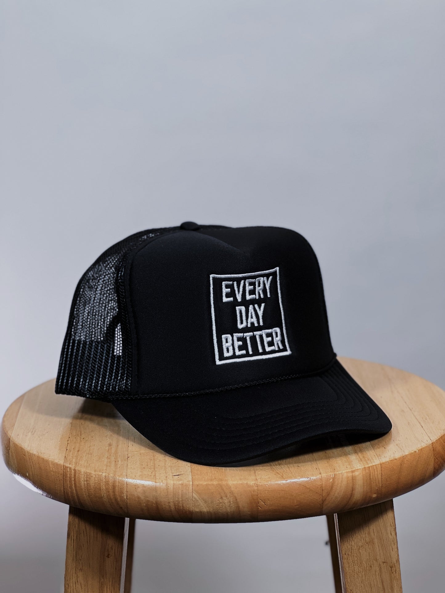 Black w/ White EVERY DAY BETTER Logo "TRUCKER HAT"